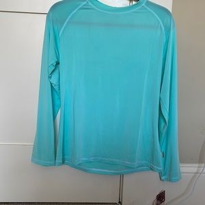 NWT. Suzzi rash guard with sun protection at 50+ UVP, ultraviolet protection.